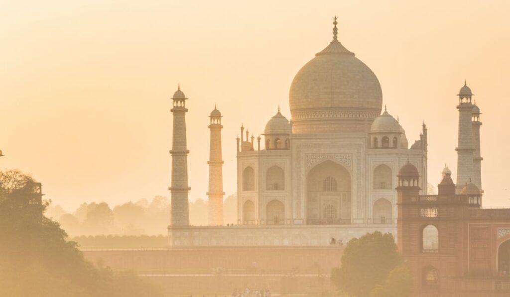 Majestic view of the Taj Mahal’s domes and minarets during dawn in Agra, India.
