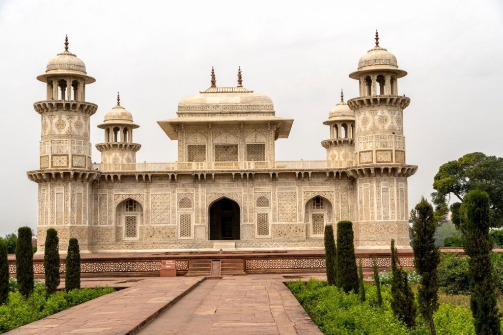 Front view of Itimad-ud-Daulah, also known as the Baby Taj, showcasing its intricate marble inlay work and Mughal architecture.