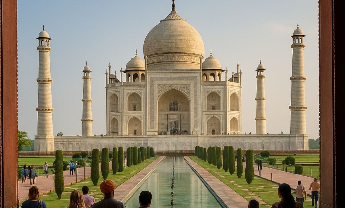 Tourists walking along the Taj Mahal’s reflecting pool toward the monument on a clear day.