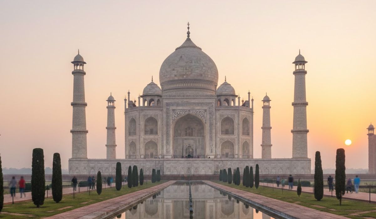 Taj Mahal at sunrise with soft morning light and calm atmosphere.