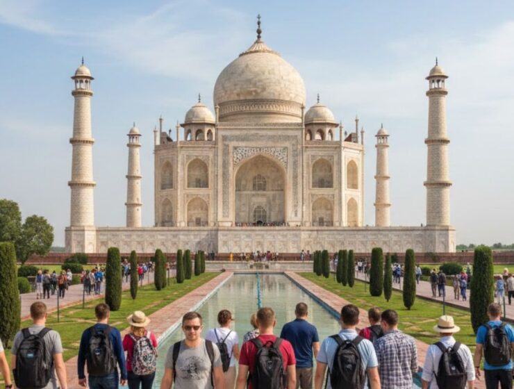Foreign tourists visiting the Taj Mahal during a same day Agra tour