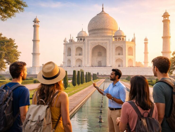A licensed tour guide explaining the Taj Mahal to a small group of travelers during a private same-day tour from Delhi.