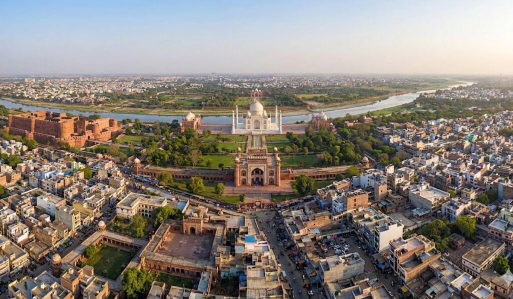 Aerial view of Agra showing the Taj Mahal, Agra Fort, and Yamuna River surrounded by the city