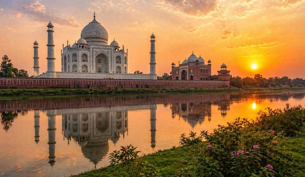 Taj Mahal sunset view from Mehtab Bagh with Yamuna river reflection and orange sky
